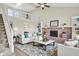Spacious living room with a brick fireplace, loft area and ample natural light at 7430 Railway Ct, Indianapolis, IN 46256