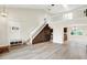 Open floor plan features stairs, a loft and coat rack and bench with basket storage at 7430 Railway Ct, Indianapolis, IN 46256