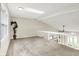 Bright loft with natural light, skylight, and open railing offers a versatile and inviting space at 7430 Railway Ct, Indianapolis, IN 46256