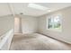 Loft space with skylight and bright window offering a versatile and well-lit area at 7430 Railway Ct, Indianapolis, IN 46256