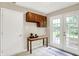 Mud room with tile floor, a table, upper cabinet and french doors to the outside at 7430 Railway Ct, Indianapolis, IN 46256