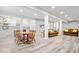 Finished basement featuring modern gray flooring, a small kitchenette and dining area, and two couches for relaxing at 745 Ridge Gate Dr, Brownsburg, IN 46112