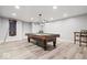 Recreation room features a pool table and ample lighting at 745 Ridge Gate Dr, Brownsburg, IN 46112