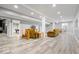 Finished basement featuring modern gray flooring, neutral walls and furniture for relaxing or entertaining at 745 Ridge Gate Dr, Brownsburg, IN 46112