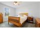 Cozy bedroom featuring a queen bed, matching nightstand, and dresser at 745 Ridge Gate Dr, Brownsburg, IN 46112