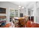 A dining room showcases a chandelier over a wooden table and four chairs at 745 Ridge Gate Dr, Brownsburg, IN 46112
