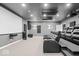 Home theater with tiered leather seating, a large projector screen, and acoustic panels for a high-quality movie experience at 745 Ridge Gate Dr, Brownsburg, IN 46112