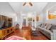 Open-concept living space showcases hardwood floors, columns, and views into the foyer at 745 Ridge Gate Dr, Brownsburg, IN 46112