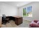 Bright office features a large desk and window overlooking the yard at 745 Ridge Gate Dr, Brownsburg, IN 46112