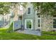 Backyard featuring a patio, green grass, and mature trees at 7507 Choate Ct, Indianapolis, IN 46254