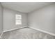 Cozy bedroom featuring neutral walls and carpet with a bright window at 7507 Choate Ct, Indianapolis, IN 46254