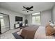 Well-lit bedroom with large window, modern furnishings, and comfortable carpet at 7507 Choate Ct, Indianapolis, IN 46254