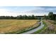 Scenic walking path meanders through lush greenery and golden fields at 7507 Choate Ct, Indianapolis, IN 46254