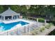 Aerial view of a community pool surrounded by lounge chairs and a fenced-in perimeter at 7507 Choate Ct, Indianapolis, IN 46254