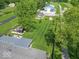 Sprawling property featuring a large lawn, multiple outbuildings, and a charming gazebo at 7850 S Mooresville Rd, Indianapolis, IN 46113