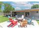 Inviting backyard with fire pit and colorful Adirondack chairs at 7850 S Mooresville Rd, Indianapolis, IN 46113