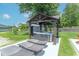 Beautiful backyard showcasing a hot tub under a gazebo and inviting lounge chairs on a concrete patio at 7850 S Mooresville Rd, Indianapolis, IN 46113