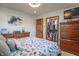 A serene bedroom showcases a walk-in closet, a dresser, and a calming blue and white color scheme at 7850 S Mooresville Rd, Indianapolis, IN 46113