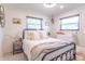Charming bedroom with ample natural light, featuring a classic metal bed frame at 7850 S Mooresville Rd, Indianapolis, IN 46113