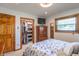 Comfortable bedroom with ample closet space and a traditional style dresser and TV at 7850 S Mooresville Rd, Indianapolis, IN 46113