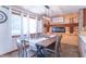 Inviting dining room features a fireplace and a rustic wood table with seating for eight at 7850 S Mooresville Rd, Indianapolis, IN 46113