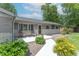 Charming front porch with seating, a manicured garden, and a welcoming entrance at 7850 S Mooresville Rd, Indianapolis, IN 46113
