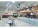A large garage with high ceilings, a loft area, and ample space for vehicles and recreation at 7850 S Mooresville Rd, Indianapolis, IN 46113