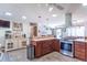 Well-lit kitchen with a center island, stainless steel appliances, and tile flooring at 7850 S Mooresville Rd, Indianapolis, IN 46113