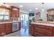 Charming kitchen featuring wood cabinets, stainless steel appliances, and sliding glass doors to the backyard at 7850 S Mooresville Rd, Indianapolis, IN 46113