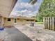 Backyard view of a detached garage, patio and landscaped yard space at 8071 Chiltern Dr, Indianapolis, IN 46268