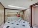 A large basement area has wood paneled walls and black-and-white tiled floors at 8071 Chiltern Dr, Indianapolis, IN 46268