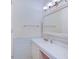Bathroom featuring white sink and cabinet, large mirror, and towel rack at 8071 Chiltern Dr, Indianapolis, IN 46268