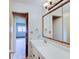 Bathroom with a large mirror over a white vanity at 8071 Chiltern Dr, Indianapolis, IN 46268