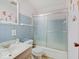 This bathroom features a shower-tub combo with sliding doors, plus a single-sink vanity at 8071 Chiltern Dr, Indianapolis, IN 46268