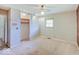 Bedroom featuring carpet, a ceiling fan, a closet, and window to let in natural light at 8071 Chiltern Dr, Indianapolis, IN 46268