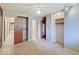 Bedroom featuring carpet, a ceiling fan, a closet, and doorway with a mirrored door at 8071 Chiltern Dr, Indianapolis, IN 46268