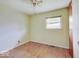 Bedroom featuring natural lighting, hardwood floors, a ceiling fan, and a view to the outside at 8071 Chiltern Dr, Indianapolis, IN 46268