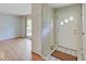 Inviting entryway with hardwood floors, tiled accents, and a coat closet for added convenience at 8071 Chiltern Dr, Indianapolis, IN 46268