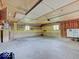 Spacious garage featuring concrete floors, overhead lighting, and ample storage shelves for organization at 8071 Chiltern Dr, Indianapolis, IN 46268