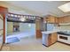 Vintage kitchen with appliances, ample cabinetry, and an open layout connecting to the living room at 8071 Chiltern Dr, Indianapolis, IN 46268