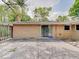 Concrete patio with brick exterior, sliding glass door, and privacy fence, perfect for outdoor relaxation at 8071 Chiltern Dr, Indianapolis, IN 46268
