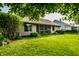 Well-maintained backyard featuring a lush lawn, mature trees and landscaping at 8223 Thoroughbred Run, Indianapolis, IN 46256