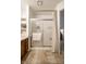 Bathroom with a walk-in shower, ceramic tile flooring, and a wood vanity at 8223 Thoroughbred Run, Indianapolis, IN 46256