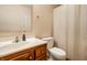 Bathroom with updated fixtures including a wood vanity, mirror, sink and toilet at 8223 Thoroughbred Run, Indianapolis, IN 46256