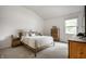 Bright bedroom featuring neutral carpet, vaulted ceilings, and ample natural light at 8223 Thoroughbred Run, Indianapolis, IN 46256