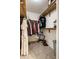 Walk in closet with carpeted floor and organized storage with clothing racks and shelves at 8223 Thoroughbred Run, Indianapolis, IN 46256