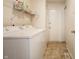 Bright laundry room featuring a washer and dryer and convenient shelving at 8223 Thoroughbred Run, Indianapolis, IN 46256