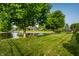 Beautiful pond surrounded by trees and manicured lawn at 8223 Thoroughbred Run, Indianapolis, IN 46256