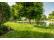 Scenic pond surrounded by lush greenery and well-maintained landscaping at 8223 Thoroughbred Run, Indianapolis, IN 46256