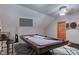 The transformed attic space features a pool table, entertainment center, and natural light at 8371 N 400 W, Fairland, IN 46126